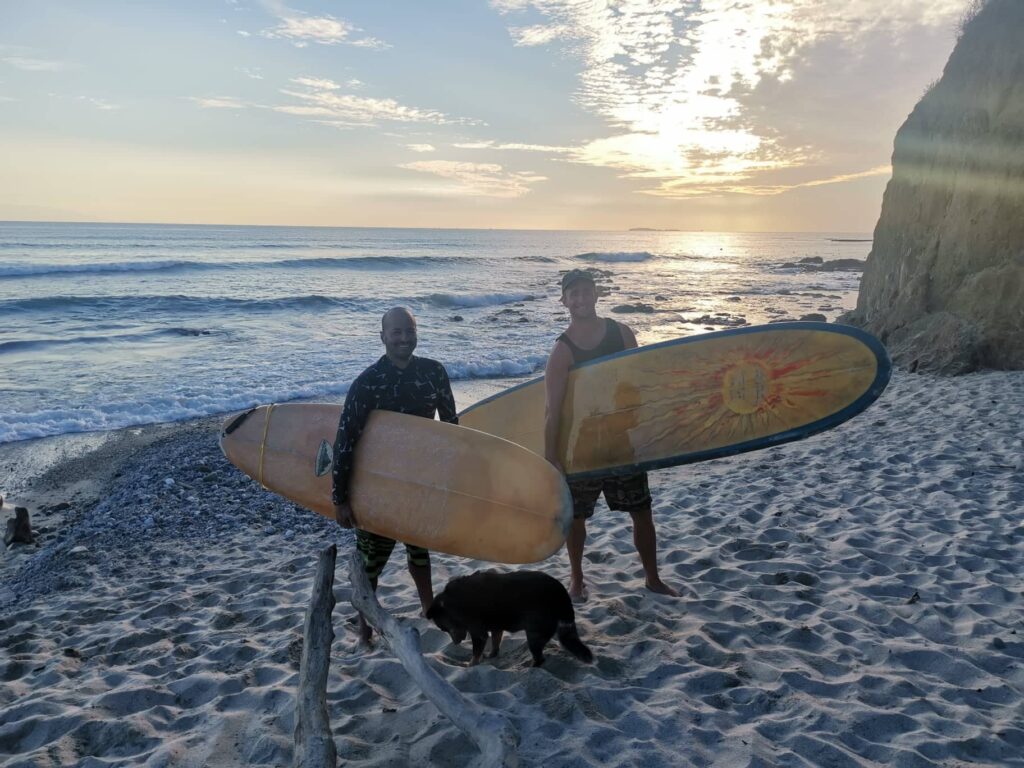 At the beach with surf boards through free accommodation found on Workaway