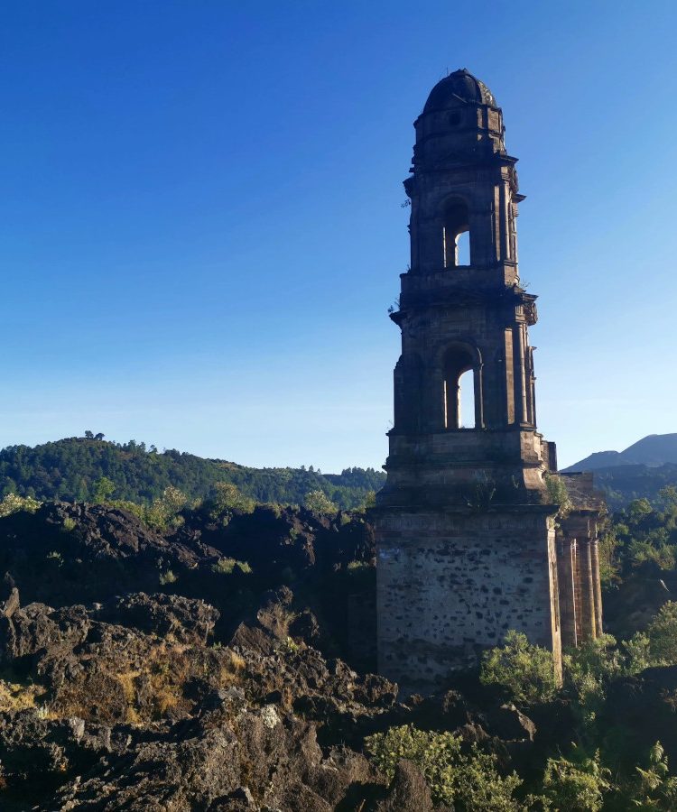 The tower of the buried church poking out next to Paricutin Volcano