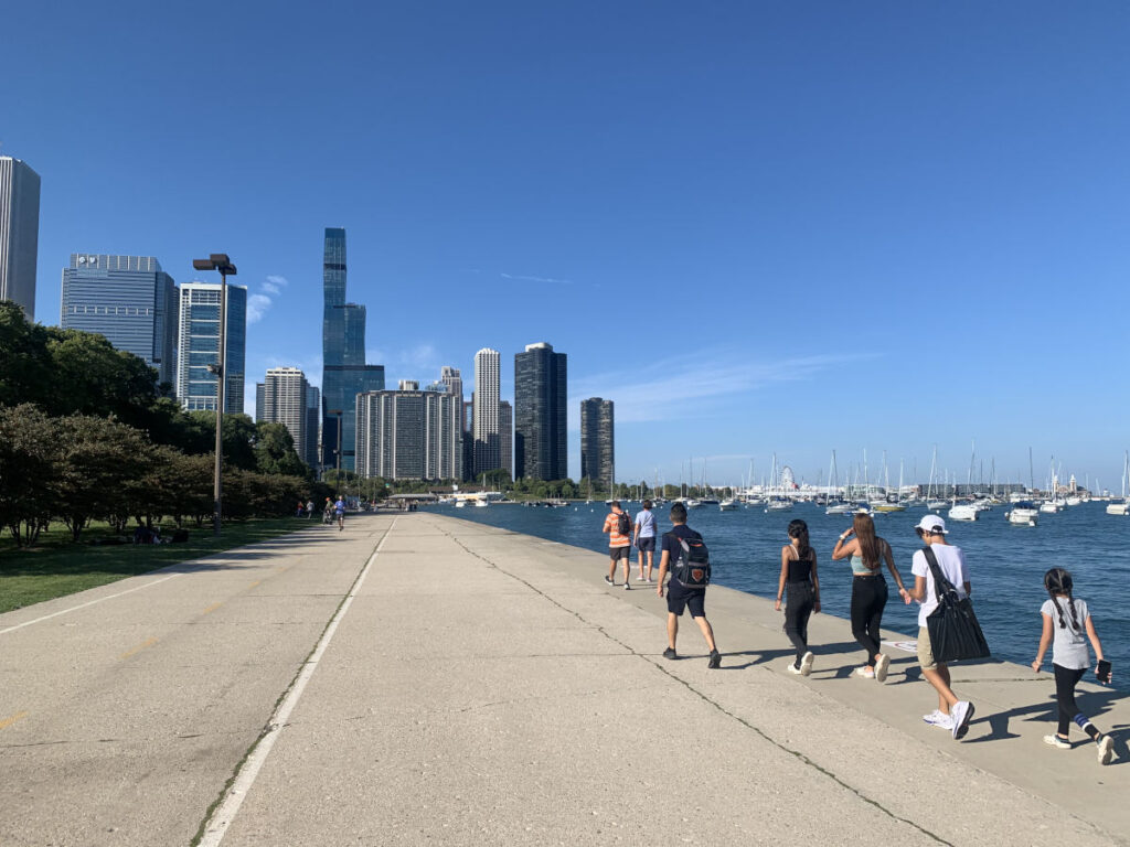 People walking along the Chicago waterfront - one of the cool things to do in Chicago!