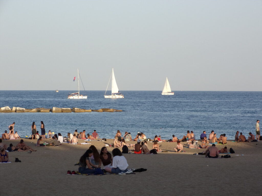 People sitting on Barceloneta beach