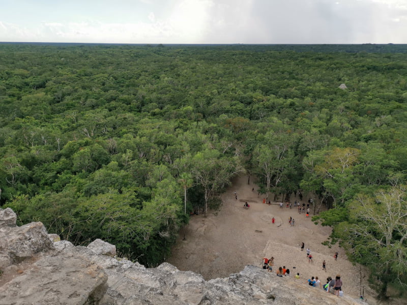 Climbing up the Coba Ruins with an amazing jungle view