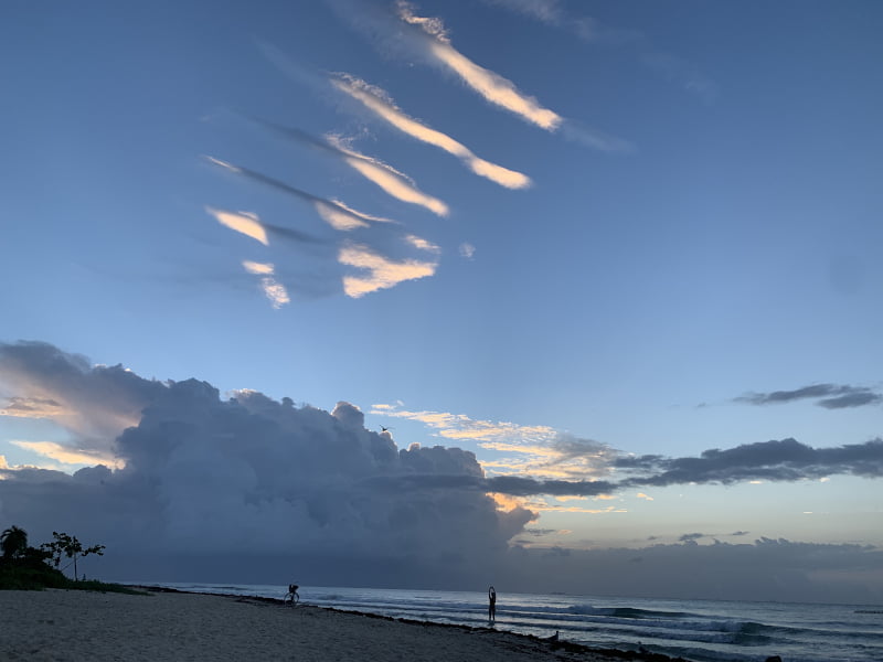 Sunrise at Punta Esmeralda with clouds shaped like stripes on a blue sky