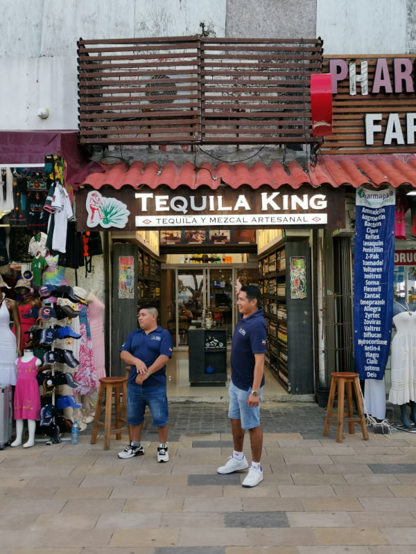 One of the many tequila shops along 5th Avenue with guys waving in people to try tequila