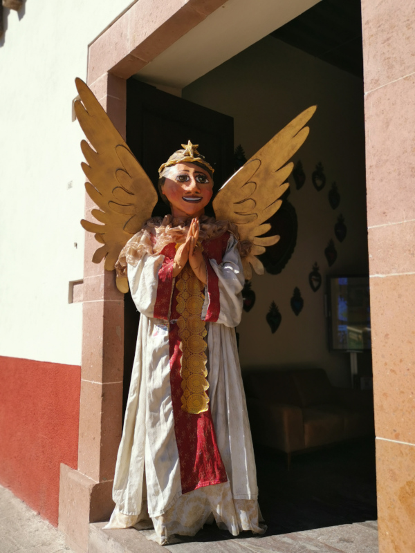 Big angel statue in an entrance of the tourist information of San Miguel de Allende