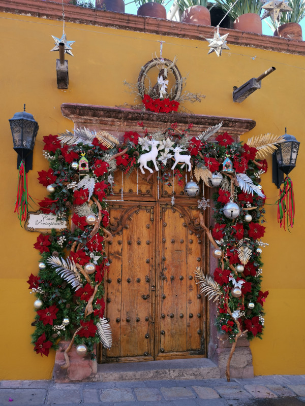 Colorful Christmas doorframe with little rendeers