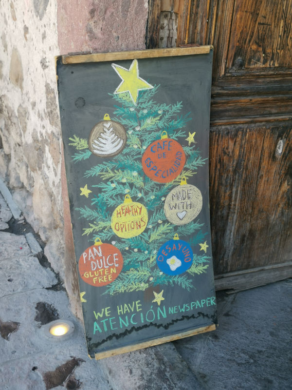 Blackboard with Christmas menu in front of a cafe in San Miguel de Allende