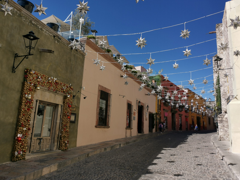 Street of San Miguel with colorful houses and blue sky