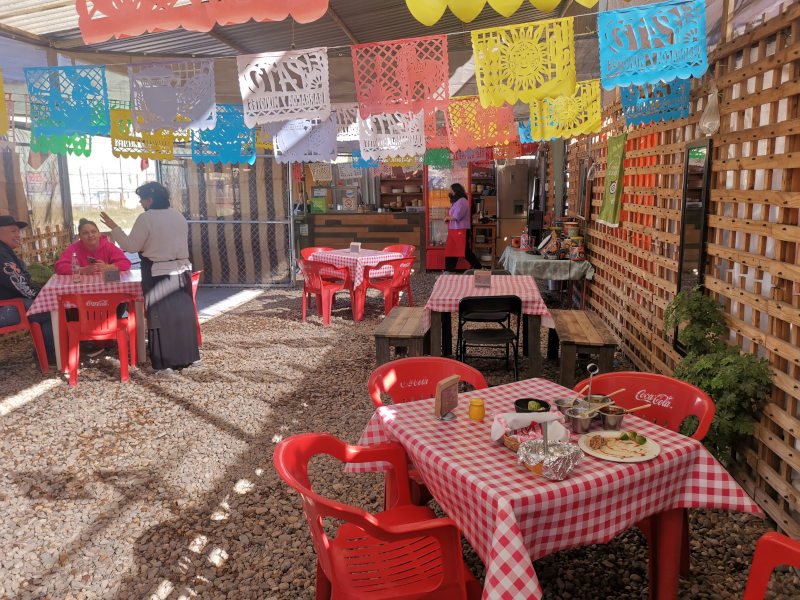 Colorful seating area at El Pato Barbacoa Y Mixiotes in San Miguel De Allende