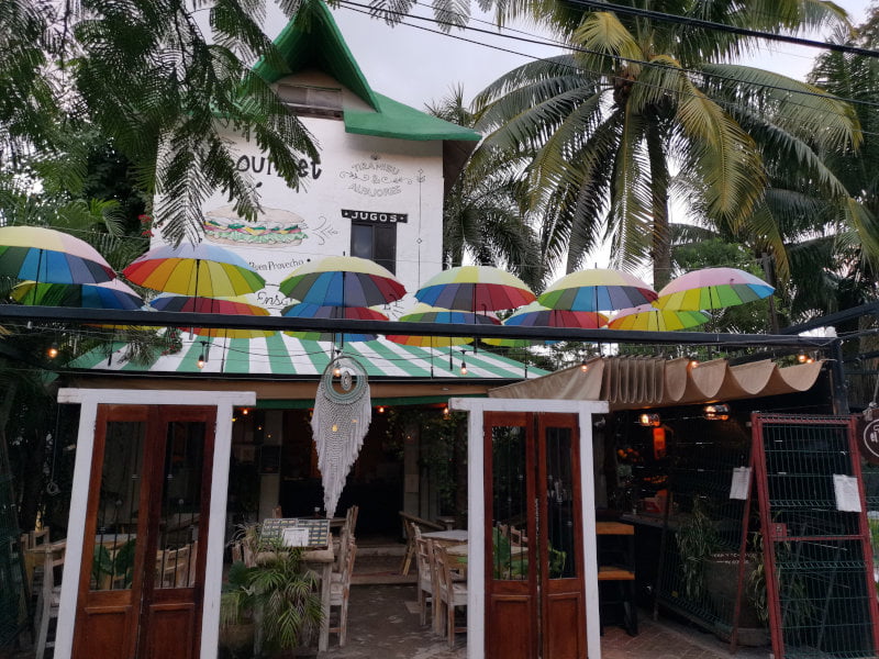 Cafe in Tulum with colorful umbrellas on top