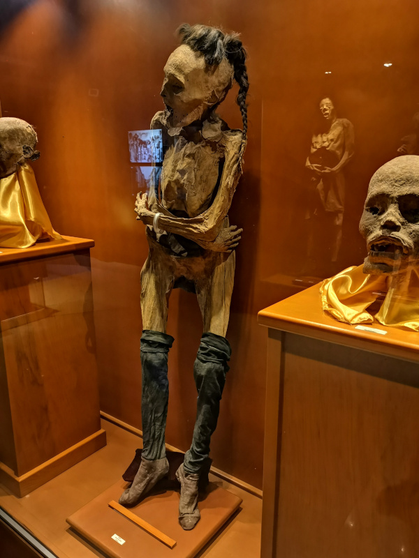 One of the mummies with stockings still on