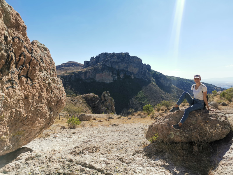 Katharina sitting on a rock overlooking the valley of Guanajuato