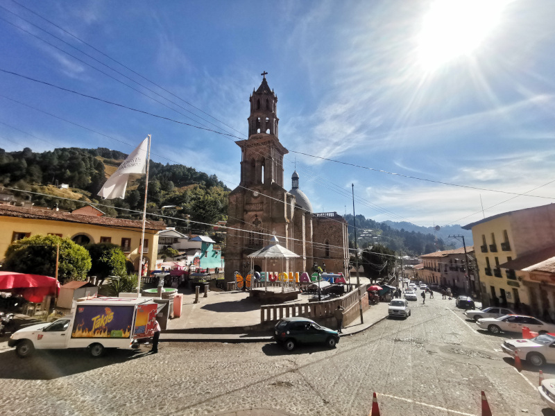 The central square in Angangueo with the main church and the Angangueo letters