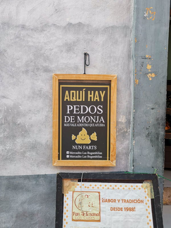 A sign advertising Pedos de Monja for sale
