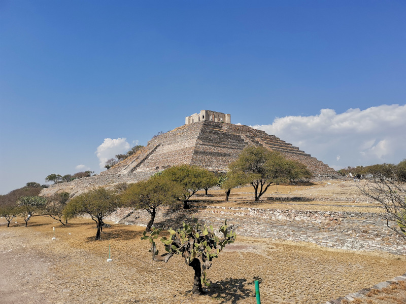 El Cerrito pyramid in Querétaro from the side surrounded by trees