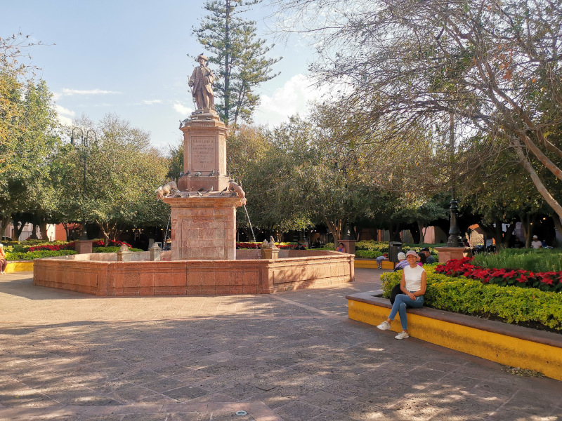 Sitting next to the fountain at Plaza de Armas - one of the best things to do in Querétaro