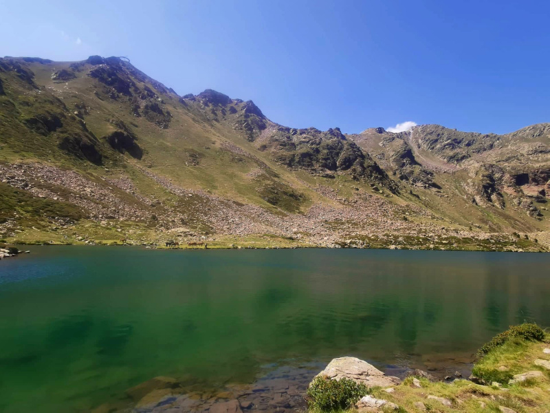 A green lake called Estany del Mig in Andorra