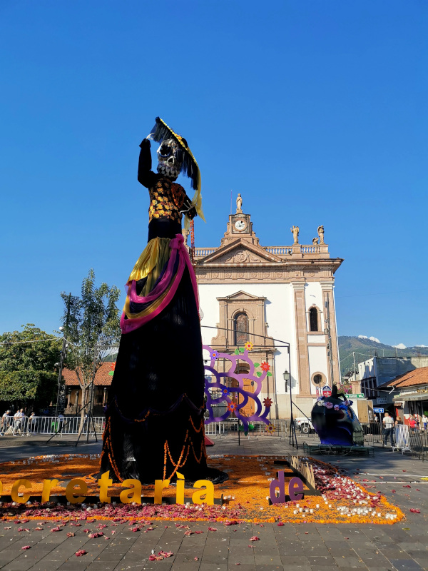 Orange Day of the Dead decorations in Uruapan, Michoacán in front of a church