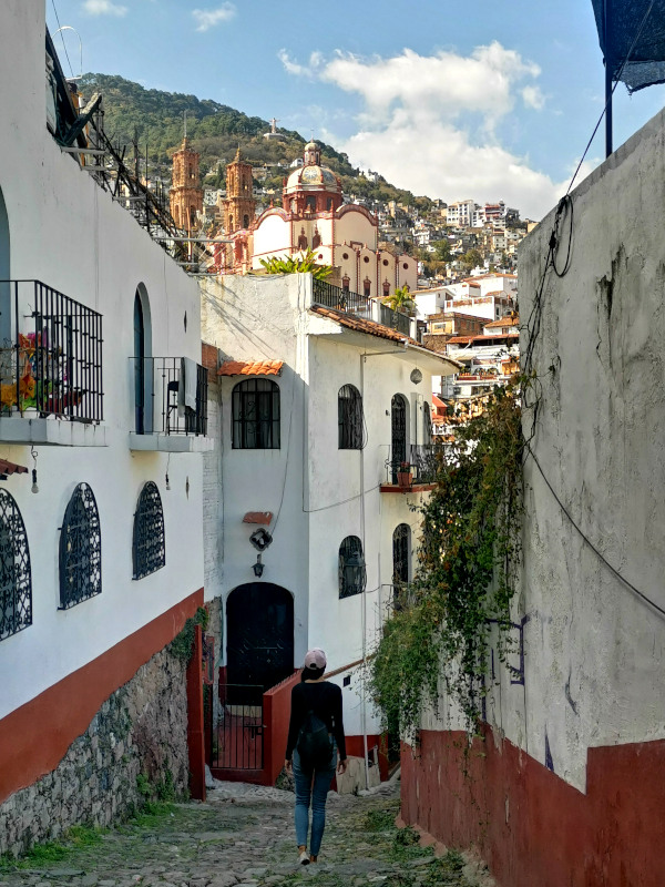 Katharina walking down an alleyway in Taxco - one of the top things to do in Taxco