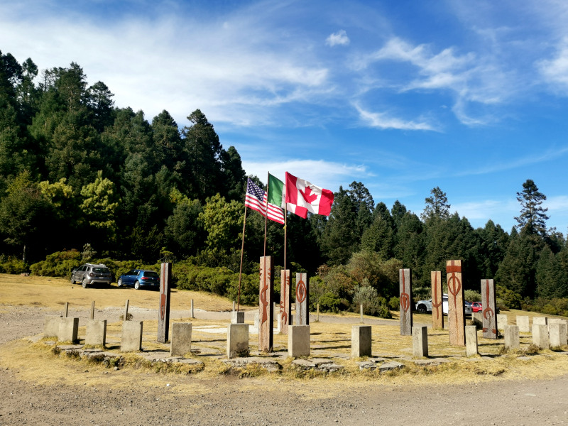 National flags of Mexico, Canada and the United States at the entrance of Sierra Chincua