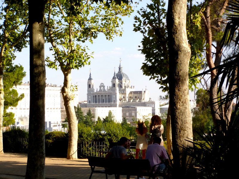 People enjoying the view of the Catedral de Almundena from near the Temple of Debod
