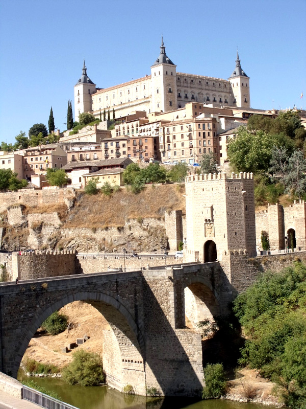 Alcazar of Toledo from the outside with three towers and many small windows