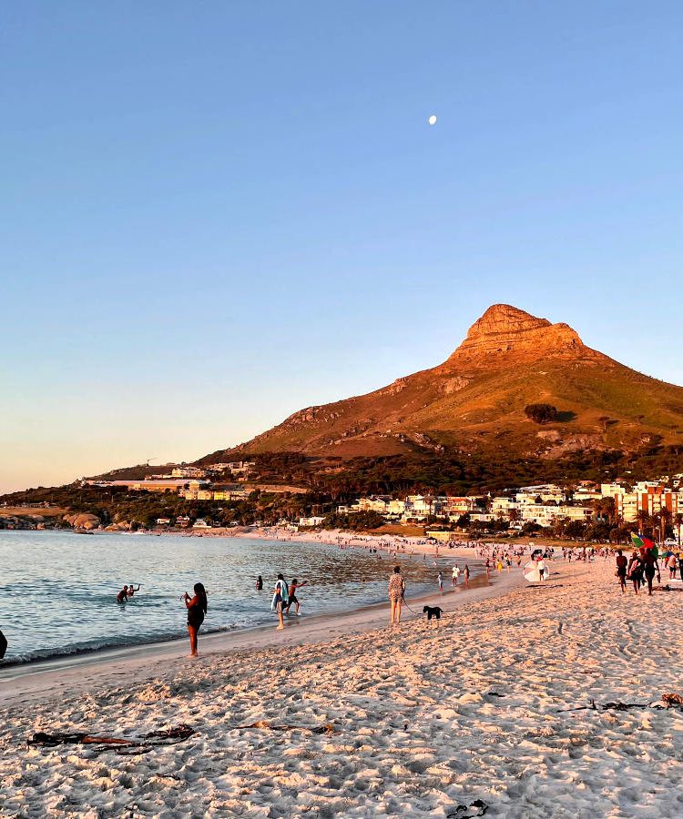 People enjoying Camps Bay one of many fun activities in Cape Town