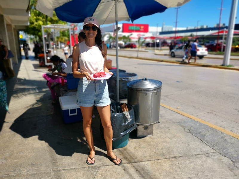 Katharina standing in front of a tamales cart in Playa del Carmen