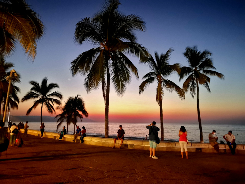 People enjoying sunset on the malecon in Puerto Vallarta one of the best cities in Mexico for digital nomads