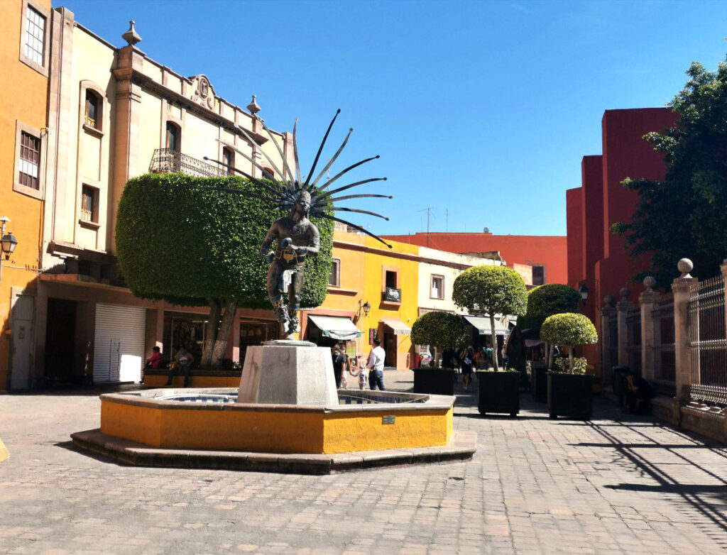 Color full square with a statue one of the top things to do in Queretaro