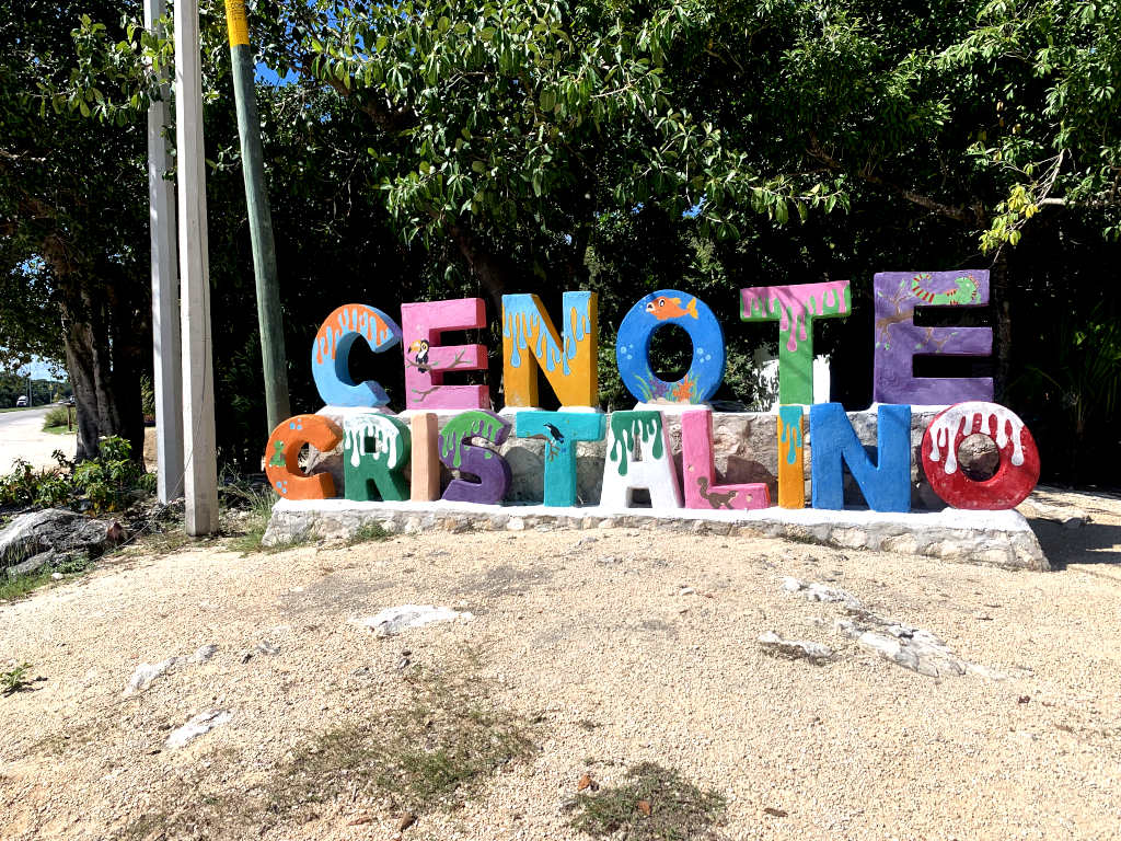 Sign of Cenote Cristilano in big colorful letters