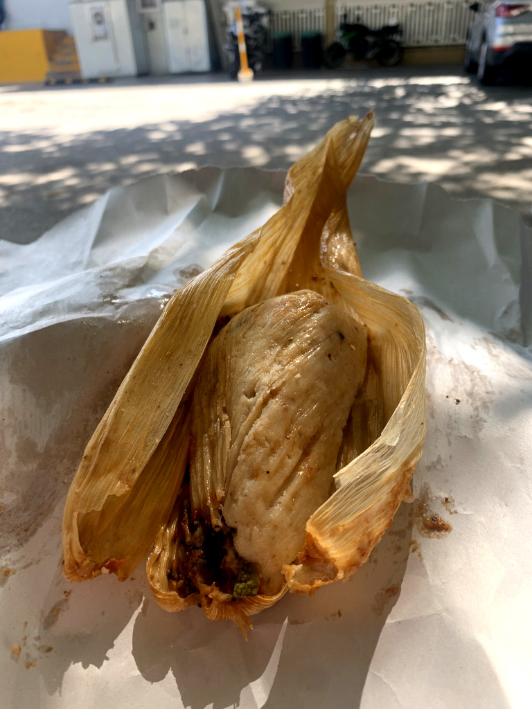 A vegan tamale on top of a piece of paper