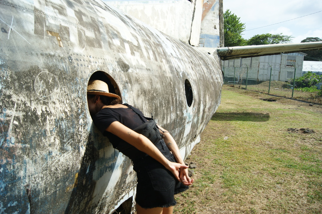 Katharina looking into the window of an abandoned plane