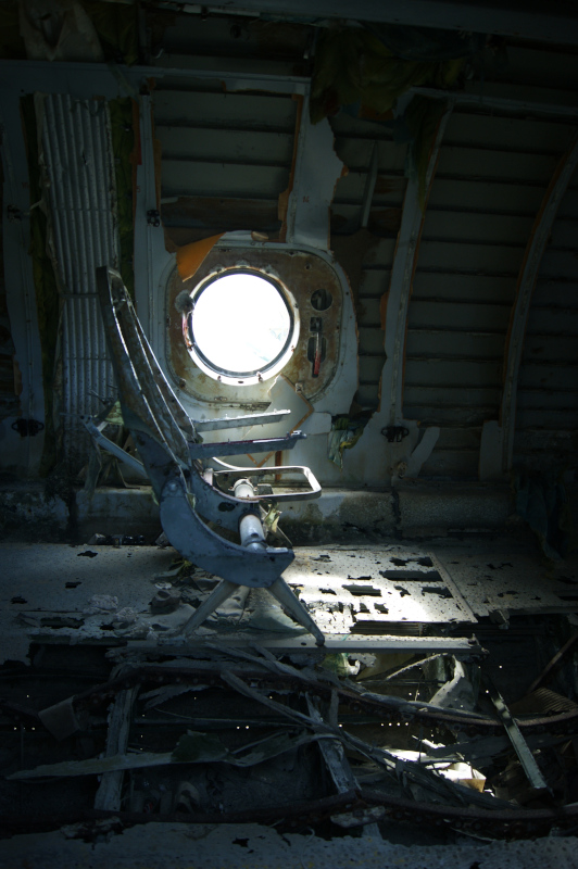 Two seats inside an abandoned plane