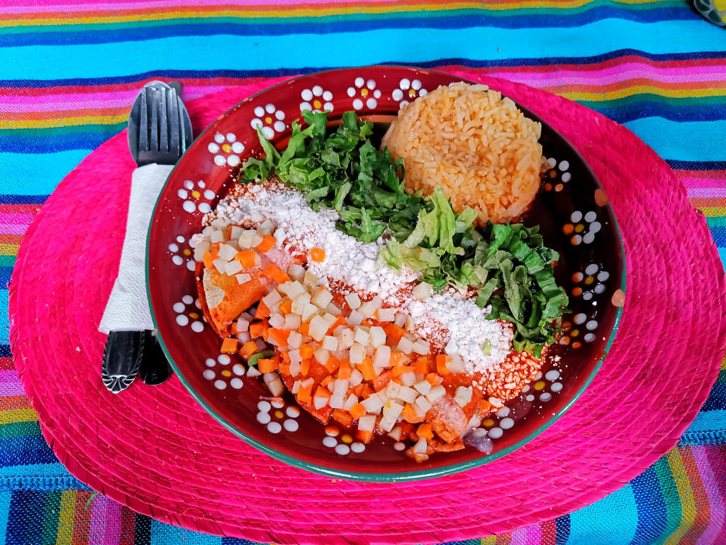 A plate of affordable and colorful vegan food in Mexico on a table - great for people traveling on a budget