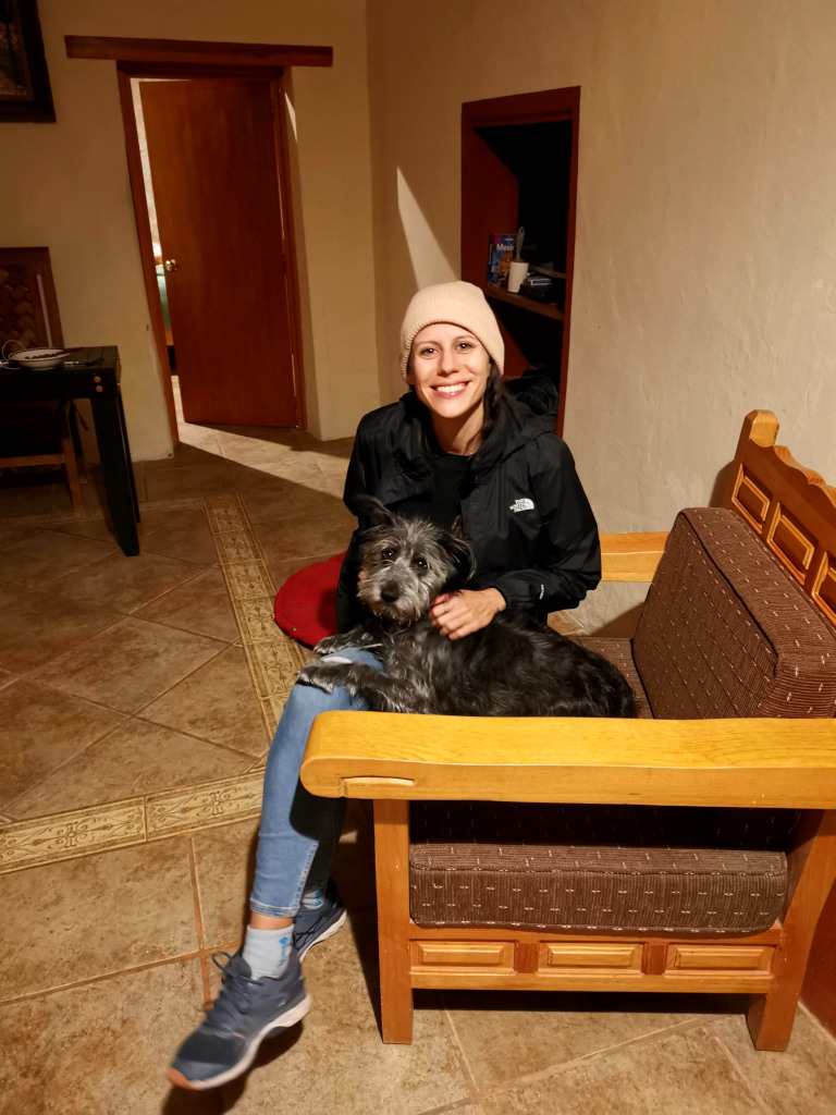 A woman sitting with a dog on a chair in Guanajuato, Mexico