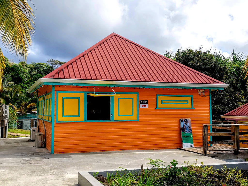 A bright orange building which is the main building of the Tri-Island chocolate company in Grenada