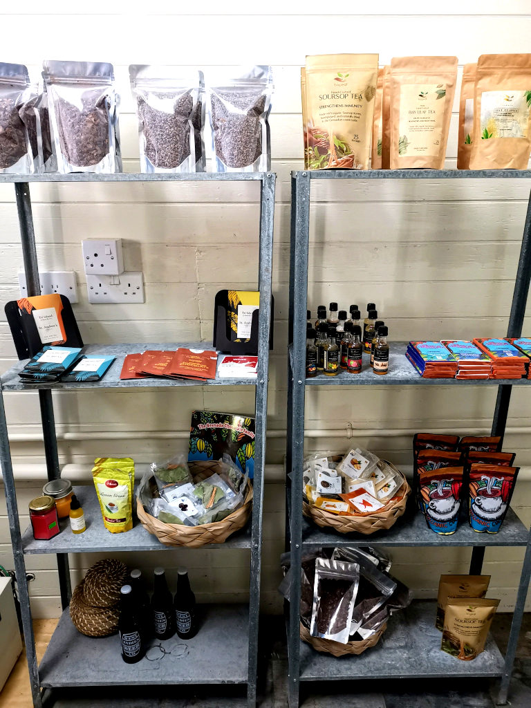 A shelf with a selection of cocoa goods on a shelf at Tri-Island chocolate
