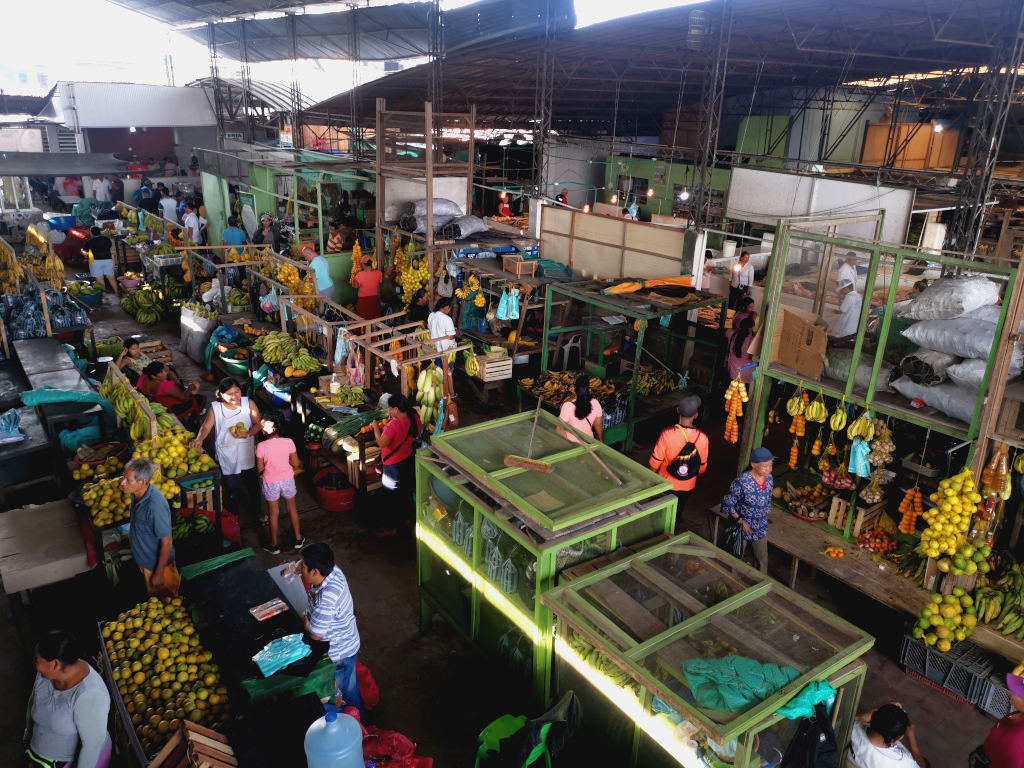 A busy market full of fruits and people doing there morning shopping in Leticia Colombia