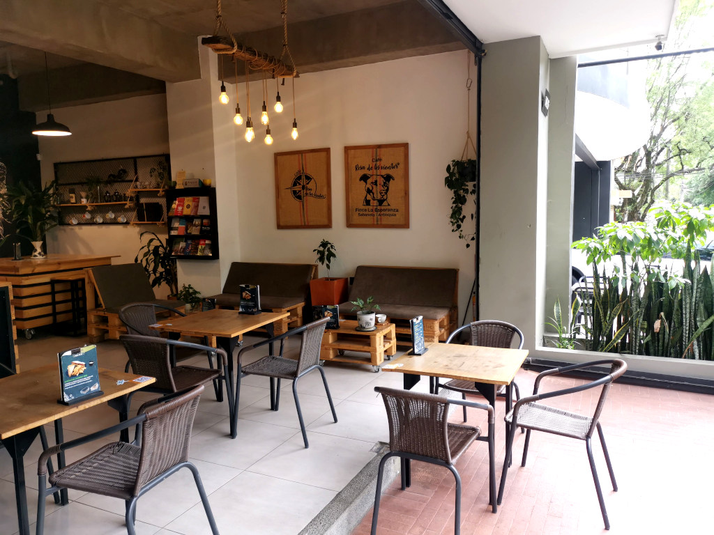 The seating area at Cafe Rosas de los Vientes in Laureles