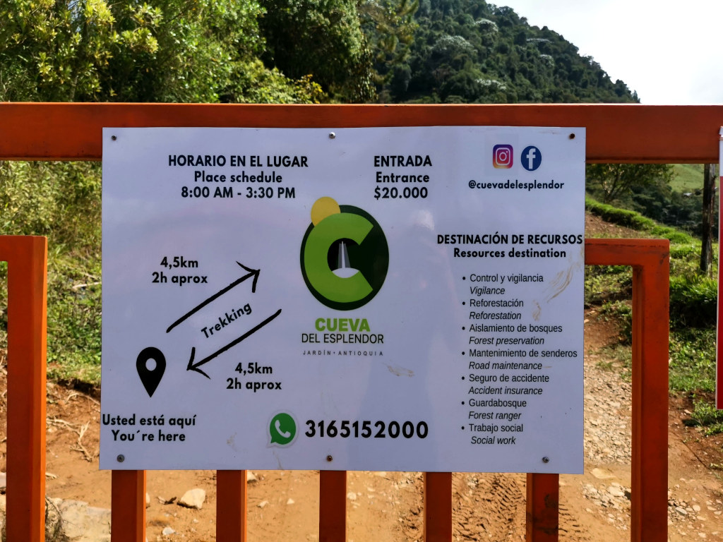 A gate at the entrance to a farm in Colombia showing the price to enter Cueva del Esplendor one of the best waterfalls near Jardin