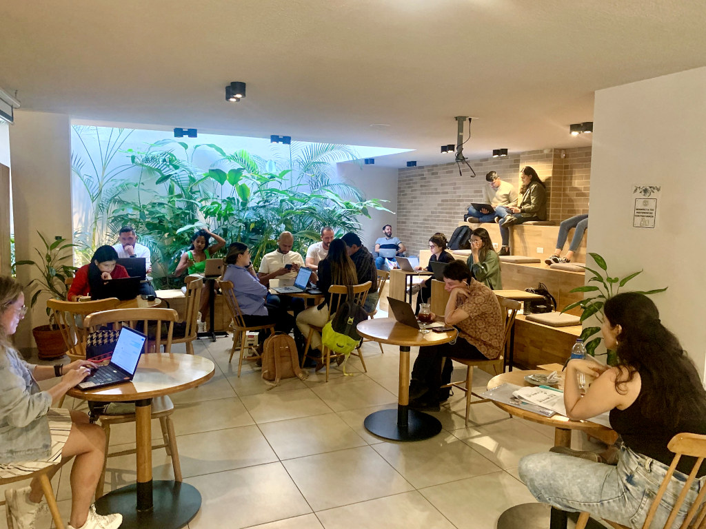A group of digital nomads working at a cafe in Medellin