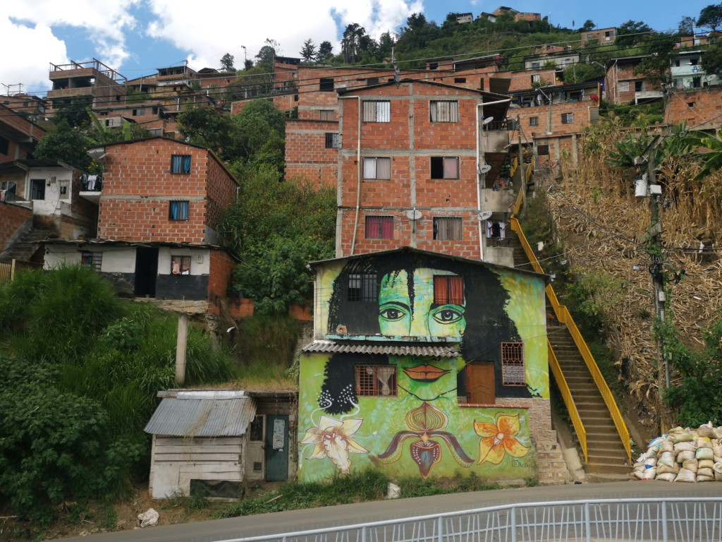 Residential houses in La Sierra Comuna 8 Medellin with a painting
