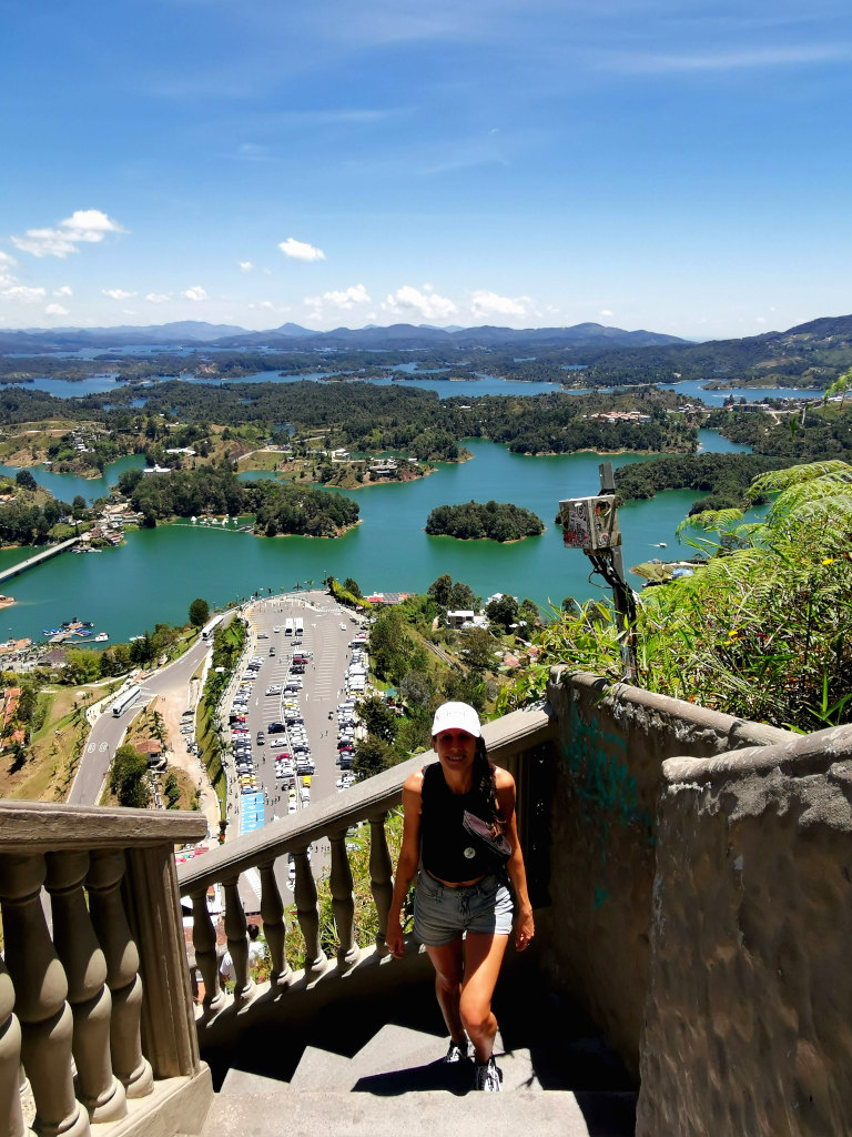 A woman standing on the stairs on El Peñol an attraction near Guatape Colombia