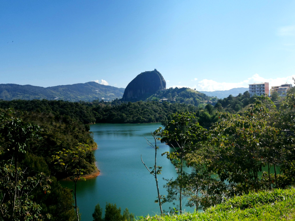 A large rock behind a lake called El Peñol one of the top things to do in Guatape