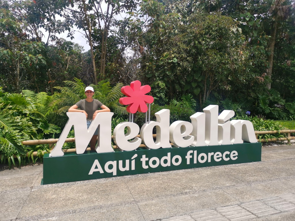 A woman posing with a Medellin sign