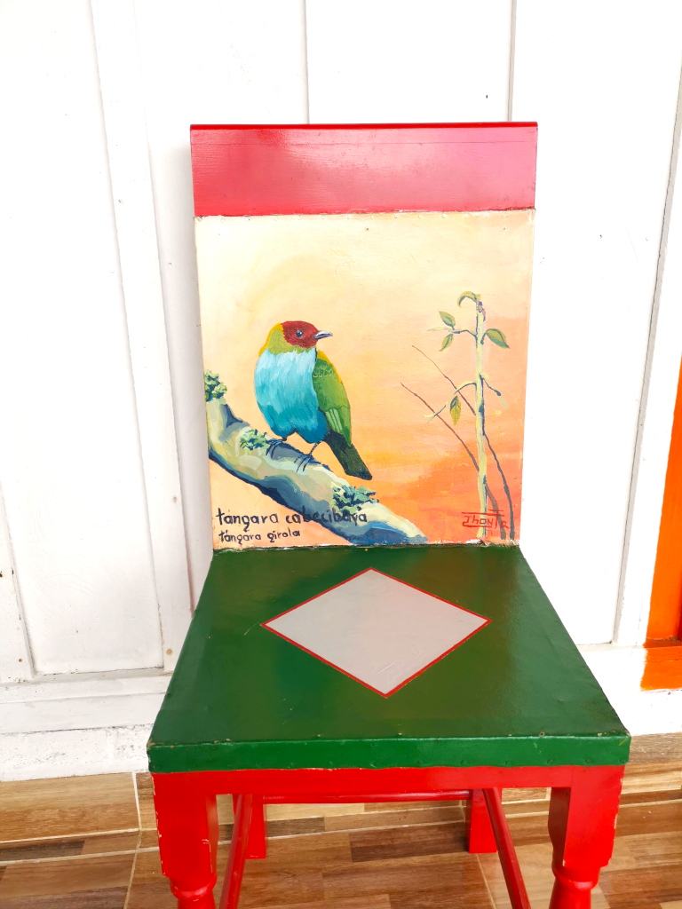 A bird painted on a colorful chair