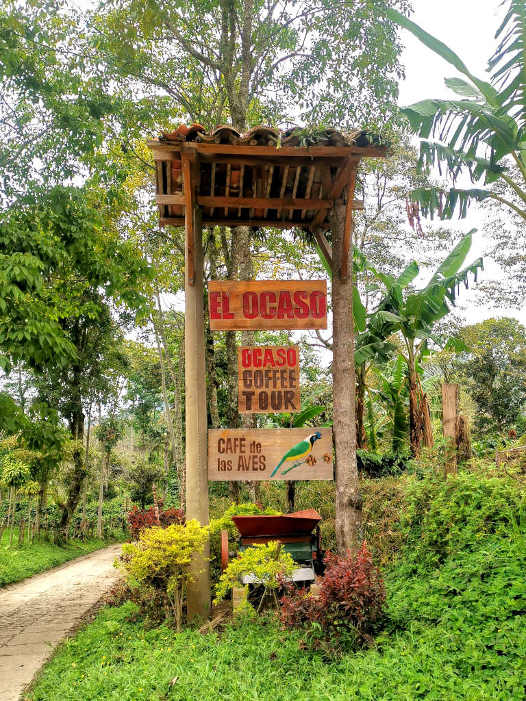 Sign advertising El Ocaso coffee farm tour Salento