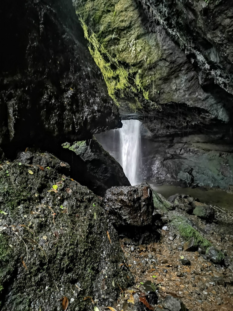Cueva del Esplendor waterfall in the distance