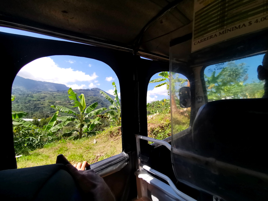 Looking out of the window of a tuk-tuk going up the hill to the entrance gate of Cueva del Esplendor