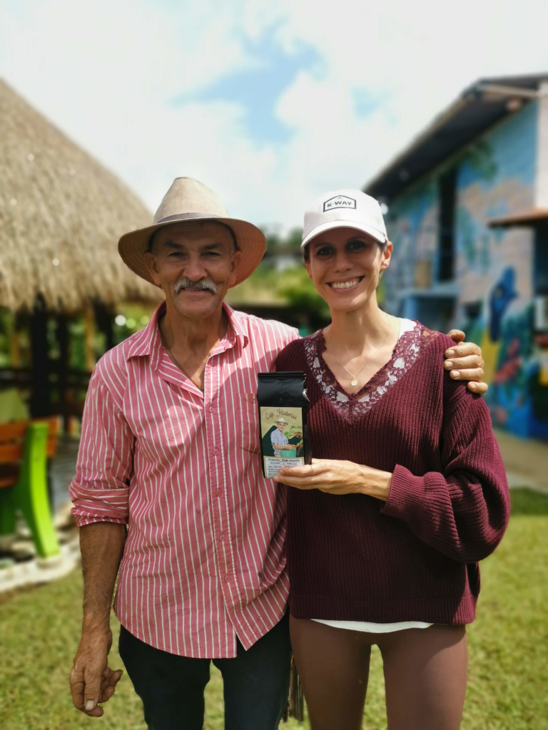 The owner of a coffee farm taking a picture with a guest from the tour one of the best things what to do in Jardin